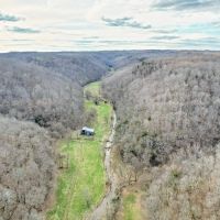 Gorgeous farm of 401.21 acres located in Clay County TN. 2 cabins and a beautiful creek running throughout the property. images 4
