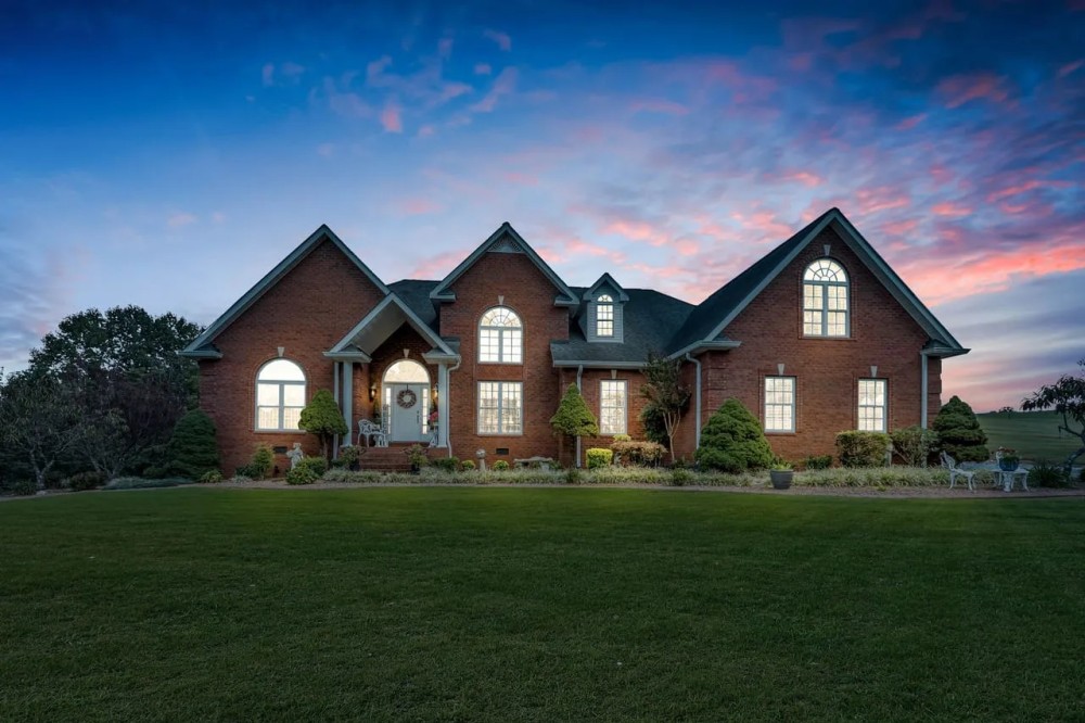 Custom 3 412 square ft brick home on 57.16 acres located in the heart of Macon County Tennessee featured image