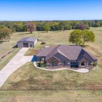 300 AC RANCH WITH STUNNING BRICK AND STONE HOME
