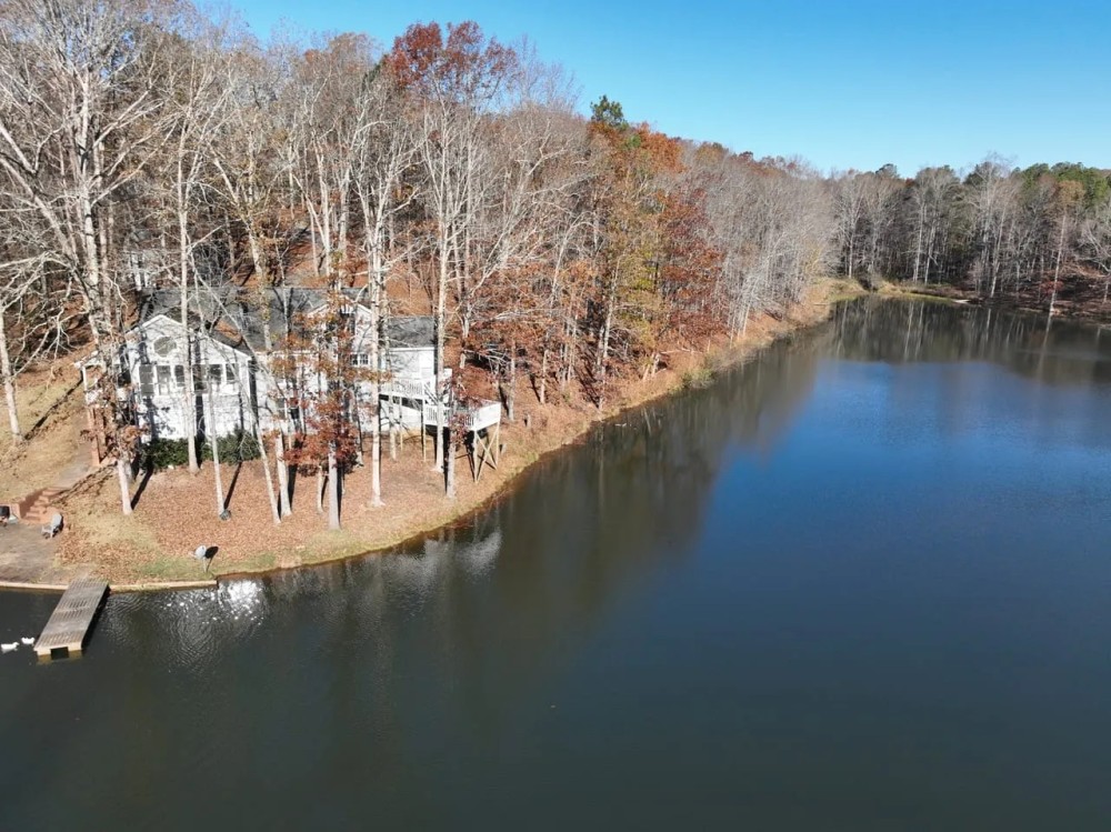 155 Acres with Stunning Lakehouse in Roopville GA featured image