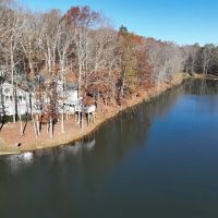 155 Acres with Stunning Lakehouse in Roopville GA