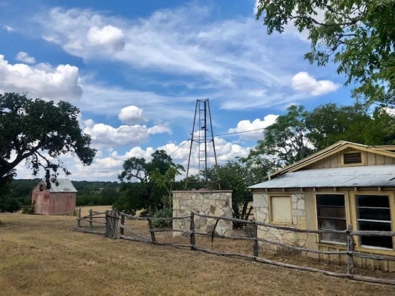 Land for sale in Walnut Springs with hunting cabin featured image
