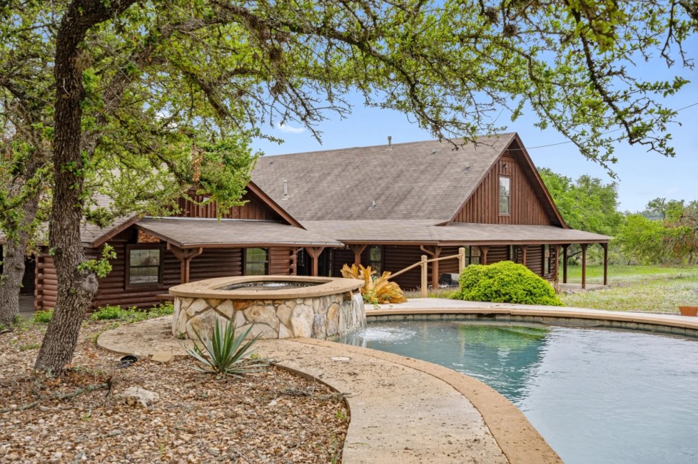 15.57 acres in Dripping Spring Custom Log Home Pool featured image