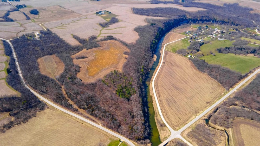 Welcome to your own private paradise atop the bluffs of scenic Bluffton Iowa featured image