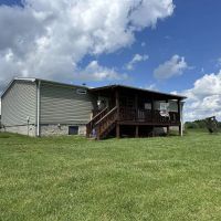 Countryside paradise with beautiful 3-bedroom 2-bathroom home nestled on 21.98 acres of prime land located in Macon County TN images 4