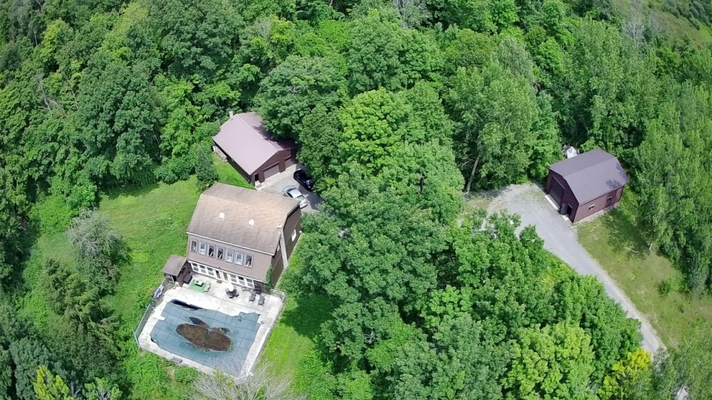 Contemporary Solar Passive Home with Barns and Pool on 30 acres in Scipio NY 1673 Kings Corners Rd featured image