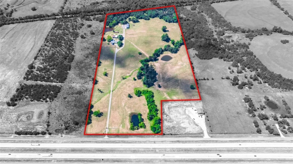 Nicely Updated House on Gated 45 Acres w 3 Outbuildings Long Driveway Interstate Frontage featured image