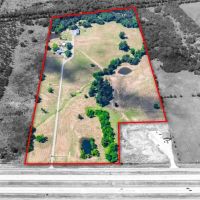 Nicely Updated House on Gated 45 Acres w 3 Outbuildings Long Driveway Interstate Frontage