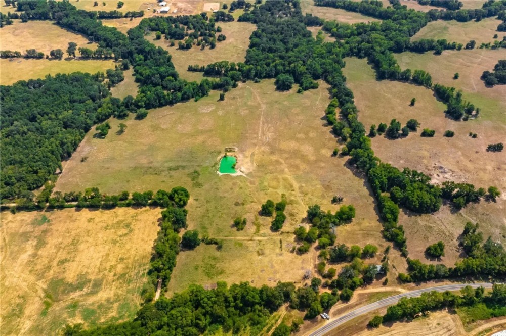 Scenic 87 acres with rolling hills part-wooded pond featured image