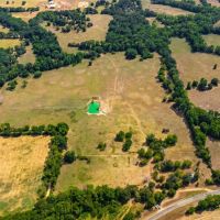 Scenic 87 acres with rolling hills part-wooded pond