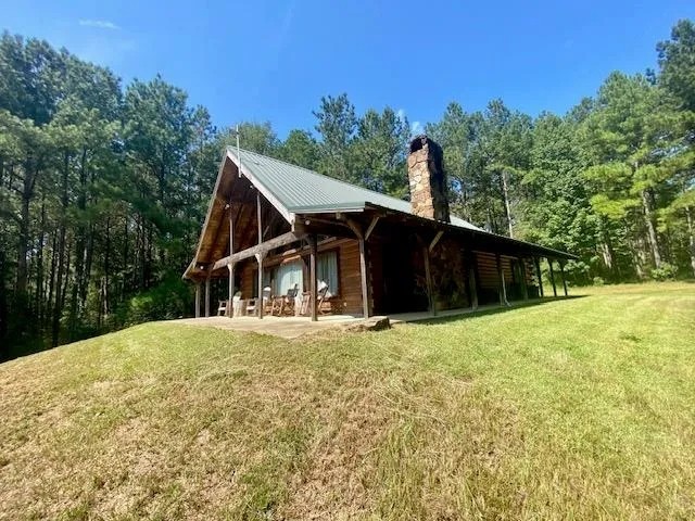 Secluded Log Cabin overloooking 5 ac Lake- 130 acres featured image
