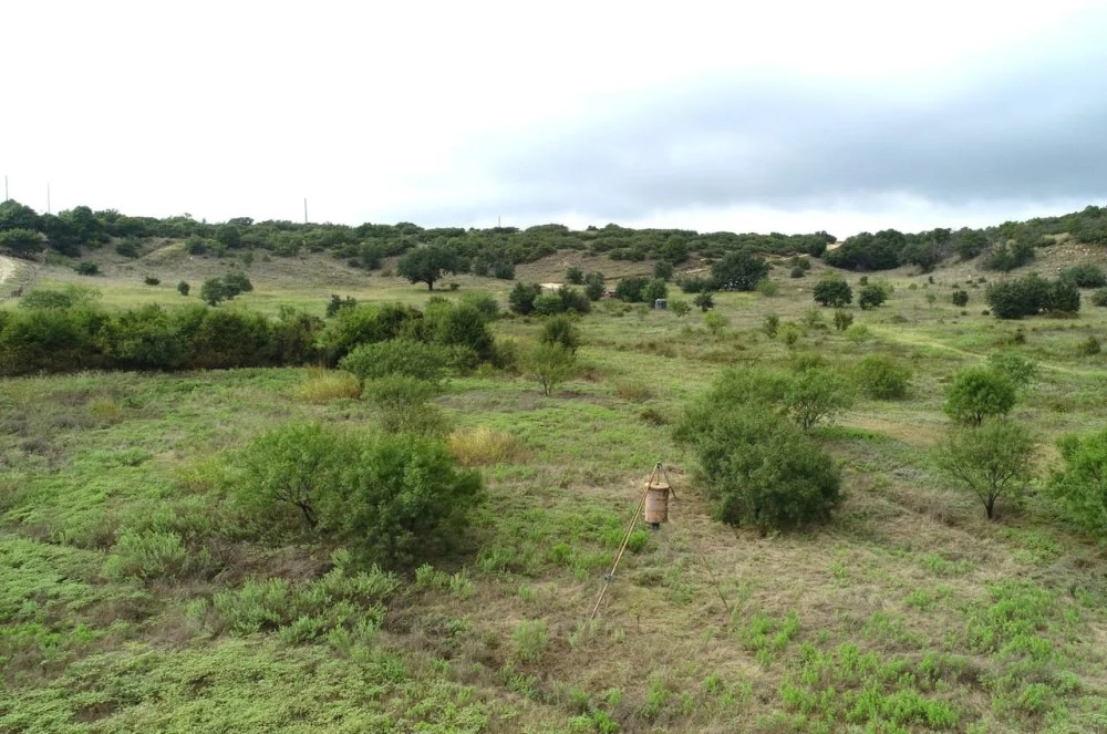 Hilltop views with oak trees electricity water well featured image