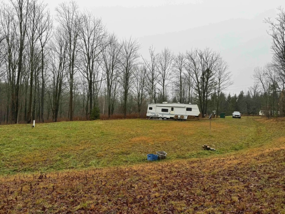 5.7 acre Building Lot with Camper Barn and All Utilities in Lyndon NY 1198 Abbott Rd featured image