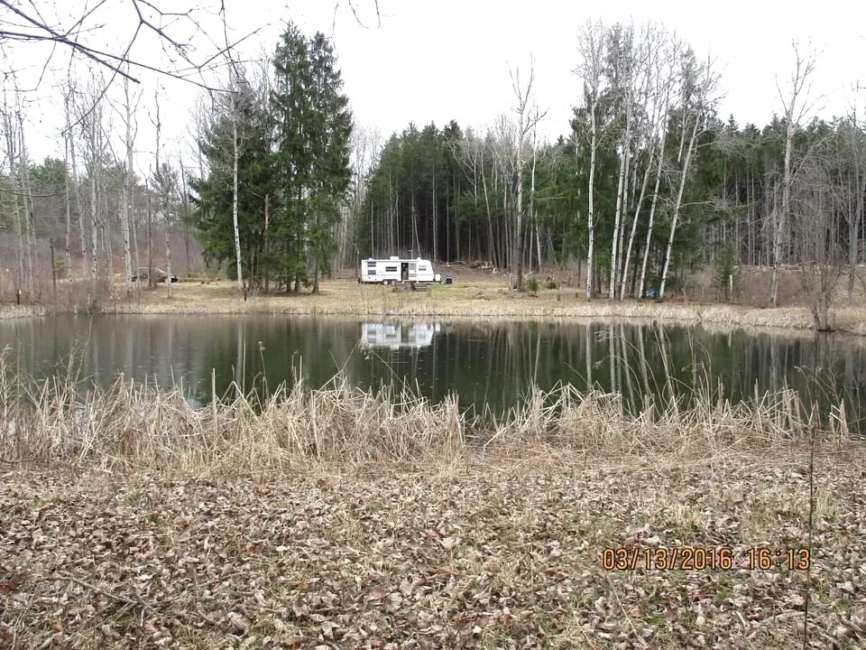 23 acres Hunting Land and Recreational Land with Pond Travel Trailer Garage and Shop in Wirt NY 6355 Wells Rd featured image