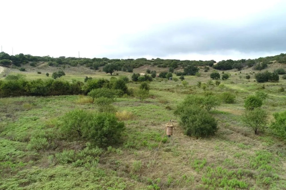 Hilltop views with oak trees electricity water well featured image
