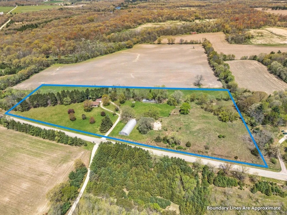 Rural Portage Ranch Home with Outbuildings featured image