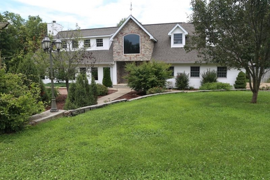 Live Water Farm with Beautiful Country Home For Sale in West Plains  MO featured image