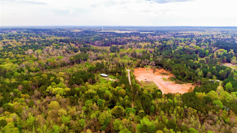 7.7 Acres Woodville Texas Homesite with Utilities AND Running Creek  10k Down featured image