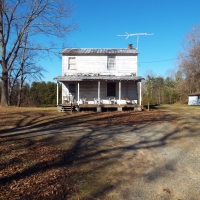 60.86 Acres Open Fields Planted Pines Road Frontage Farm House